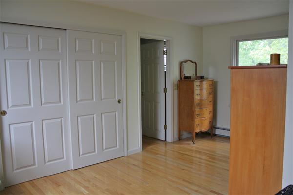 108 Telegraph Road Dennis, MA 02639 - Photo 12 of 19 a view of an empty room with wooden floor and a window