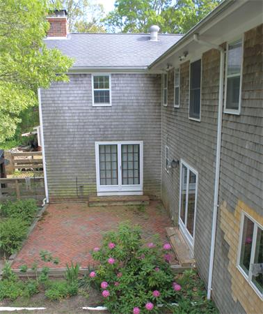 108 Telegraph Road Dennis, MA 02639 - Photo 19 of 19 a front view of a house with a garden