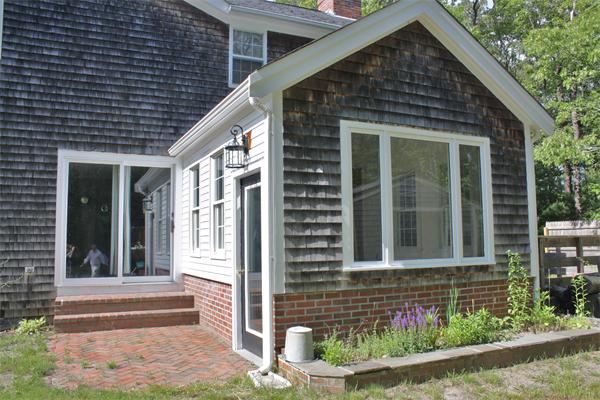 108 Telegraph Road Dennis, MA 02639 - Photo 2 of 19 a front view of a house with a porch