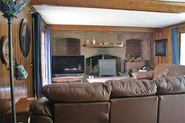 108 Telegraph Road Dennis, MA 02639 - Photo 10 of 19 a living room with furniture and a fireplace