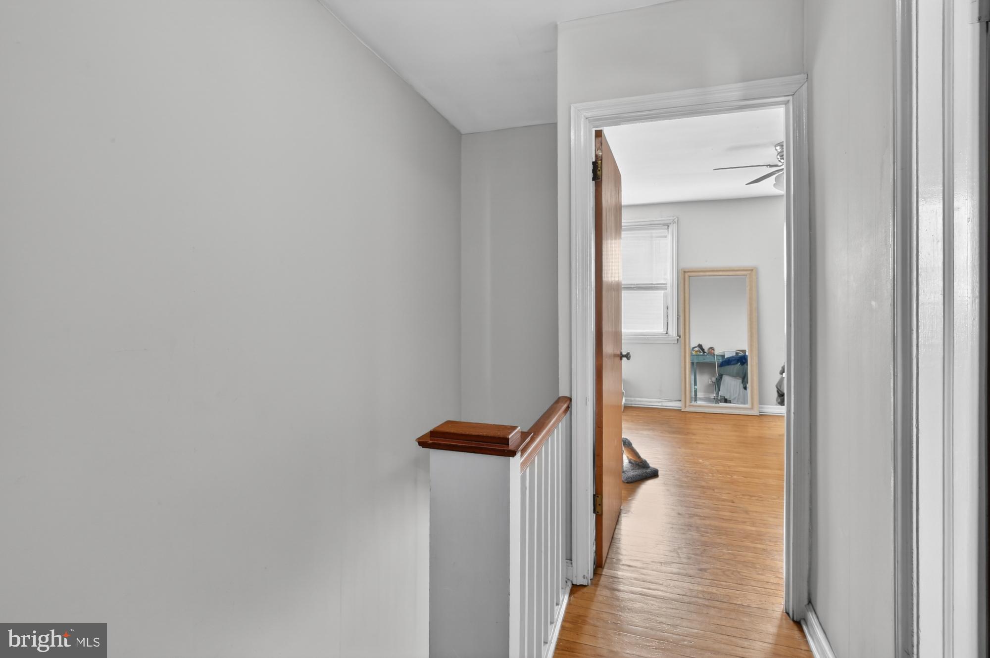 3048 Miller Street Philadelphia, PA 19134 - Photo 15 of 22 a view of a hallway with wooden floor and a bathroom