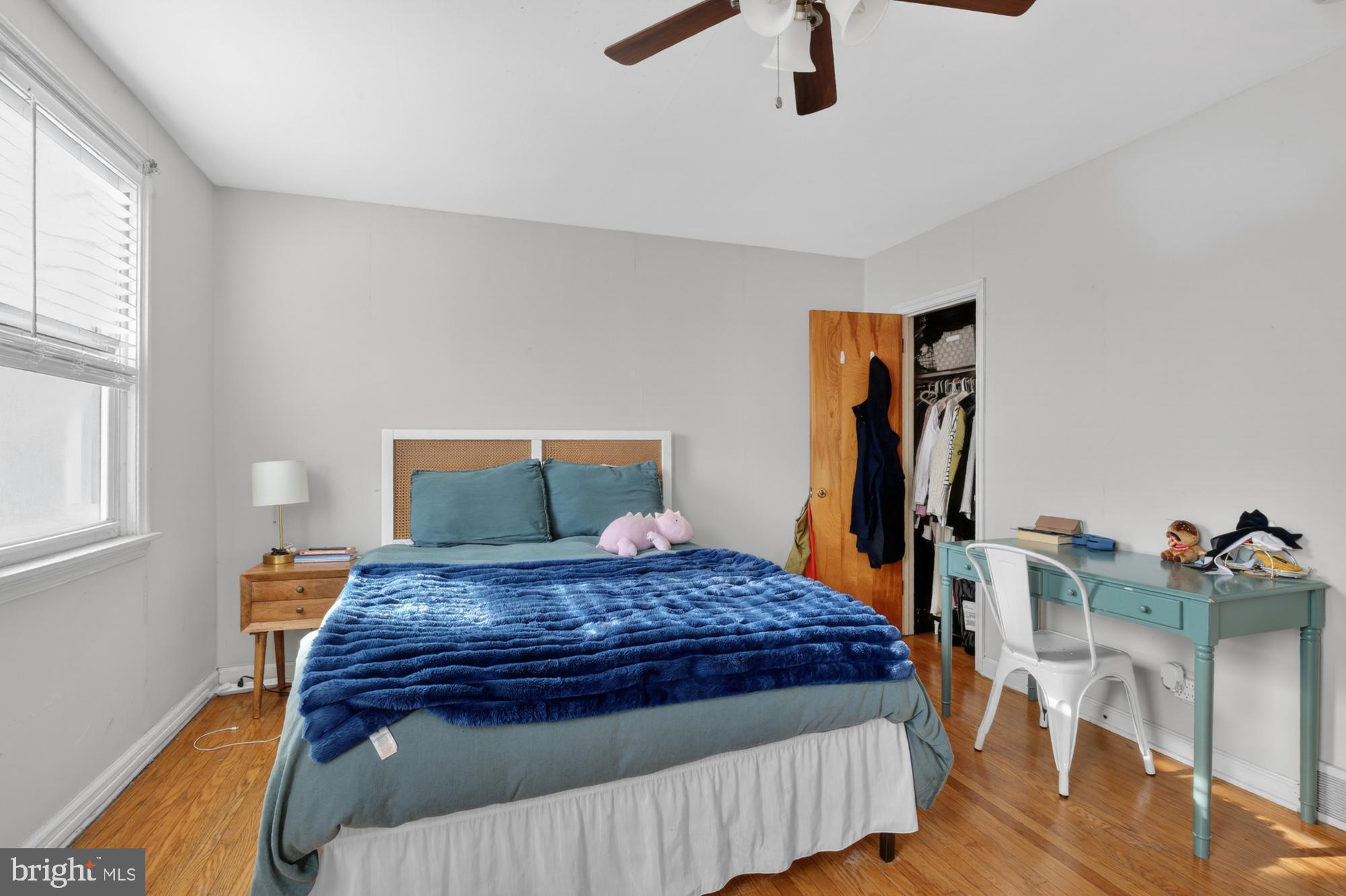 3048 Miller Street Philadelphia, PA 19134 - Photo 17 of 22 a bedroom with a bed and wooden floor