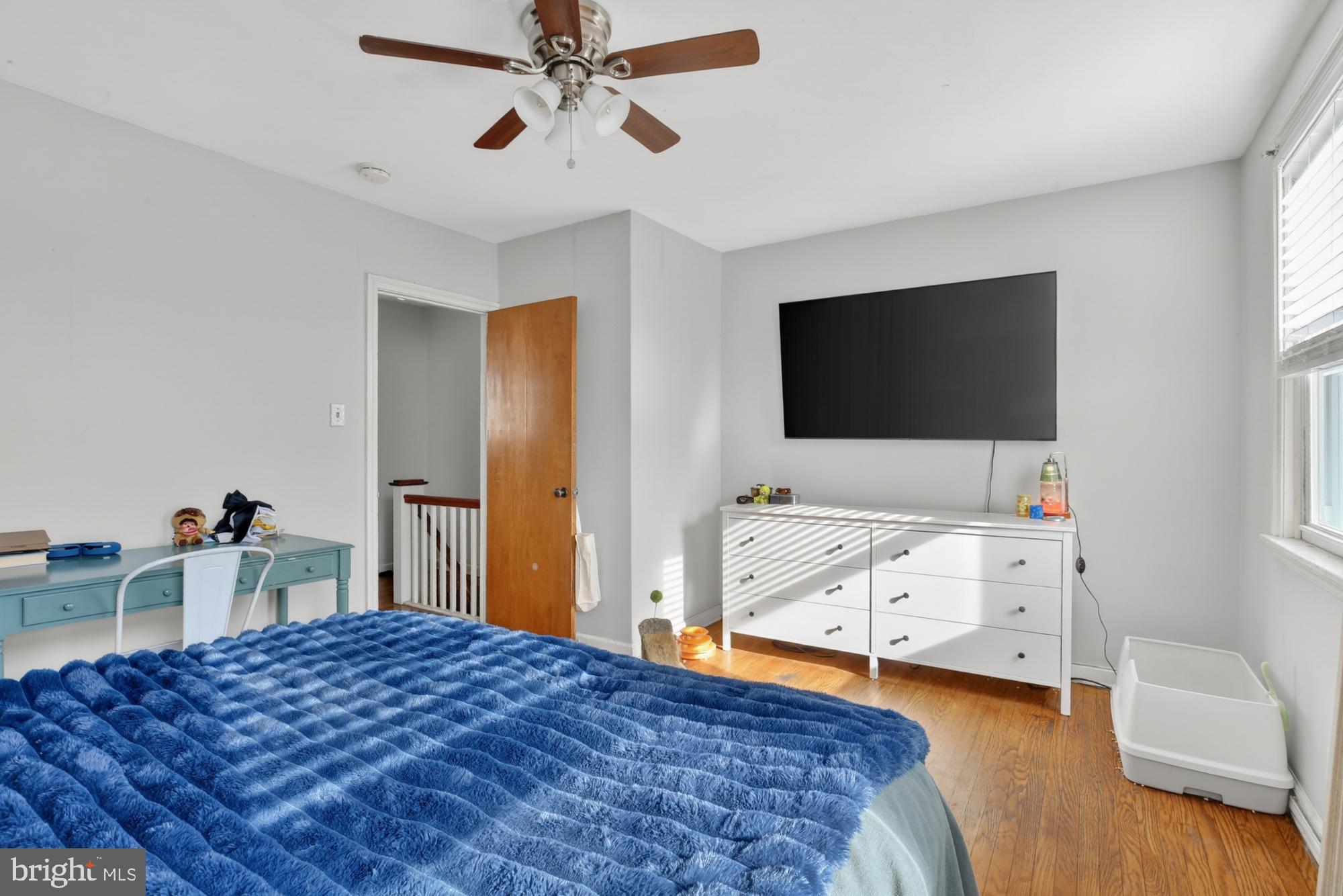 3048 Miller Street Philadelphia, PA 19134 - Photo 18 of 22 a bedroom with a bed and a flat screen tv