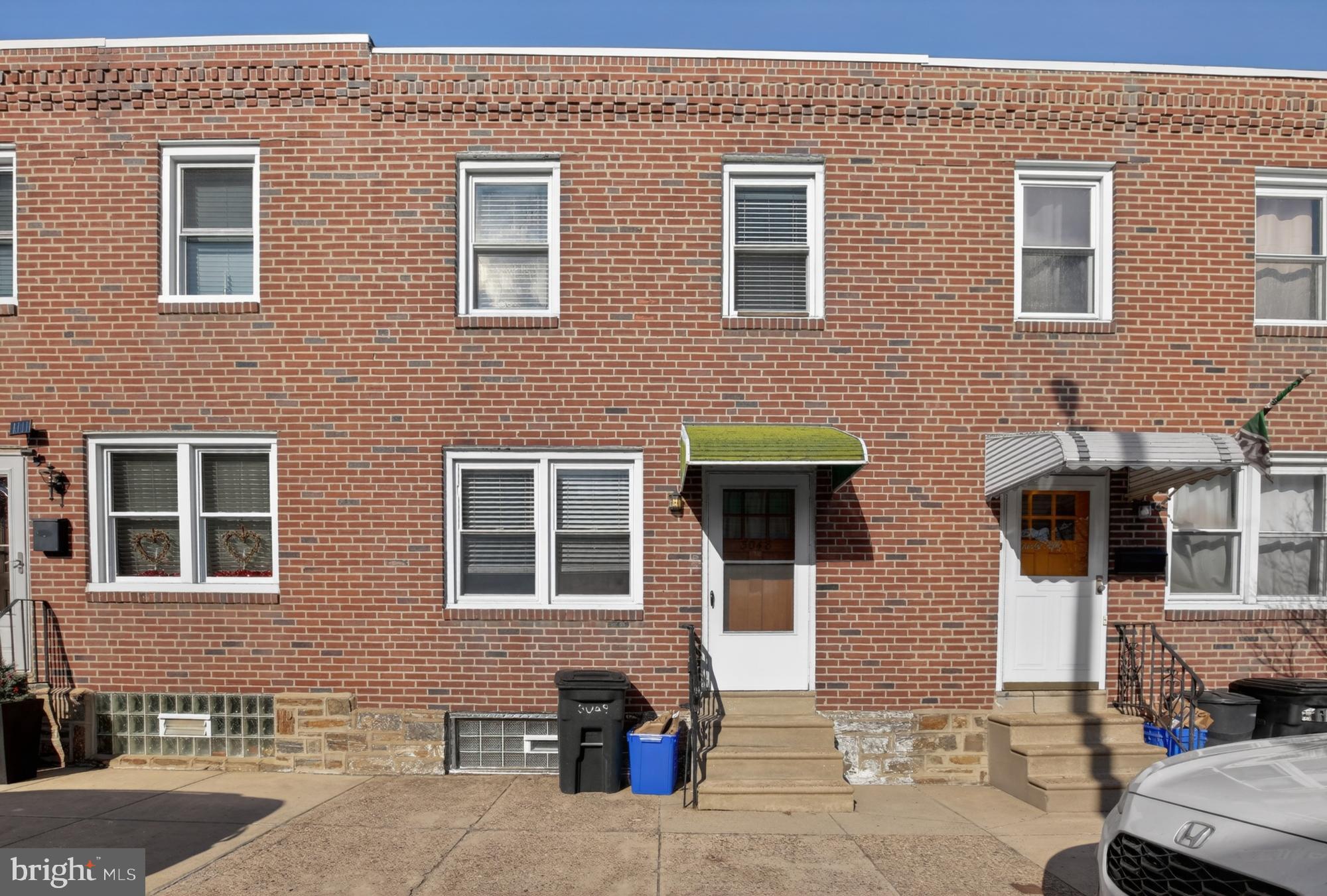 3048 Miller Street Philadelphia, PA 19134 - Photo 22 of 22 a front view of a building with many windows