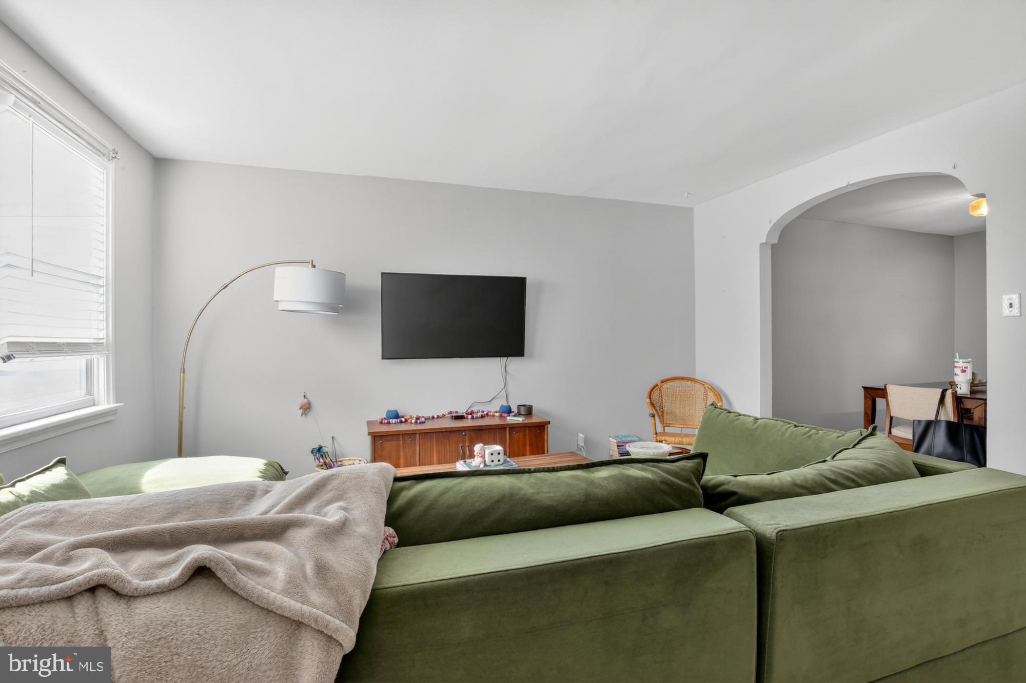 3048 Miller Street Philadelphia, PA 19134 - Photo 3 of 22 a living room with furniture and a flat screen tv