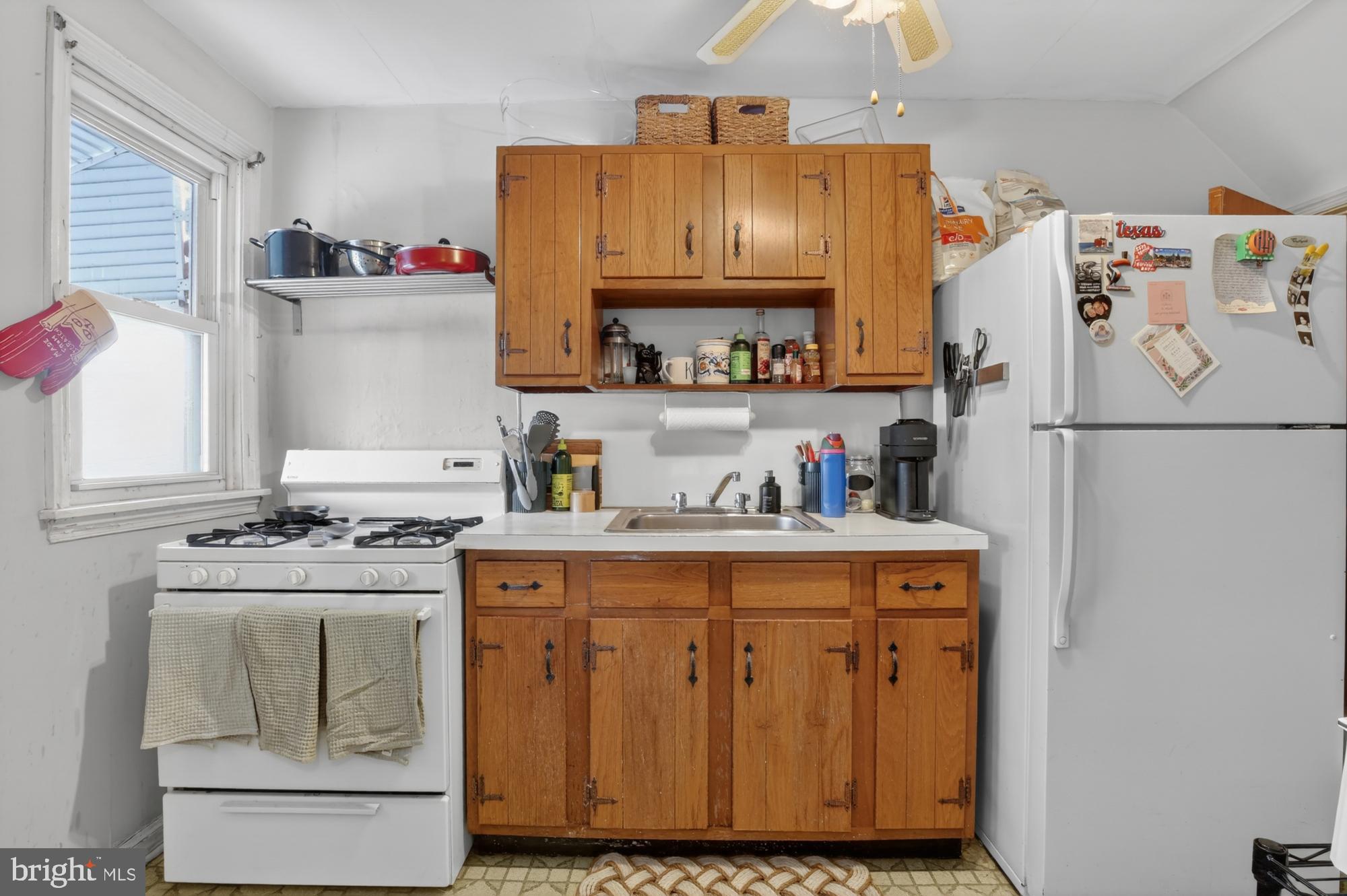 3048 Miller Street Philadelphia, PA 19134 - Photo 9 of 22 a kitchen with a refrigerator and a stove