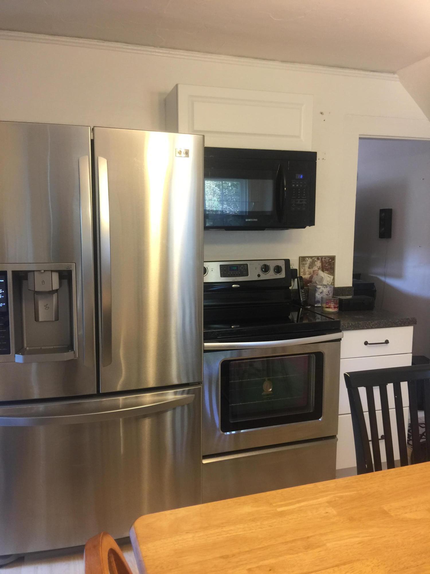 77 Brick Kiln Road Falmouth, MA 02536 - Photo 3 of 10 a kitchen with stainless steel appliances a refrigerator stove and microwave