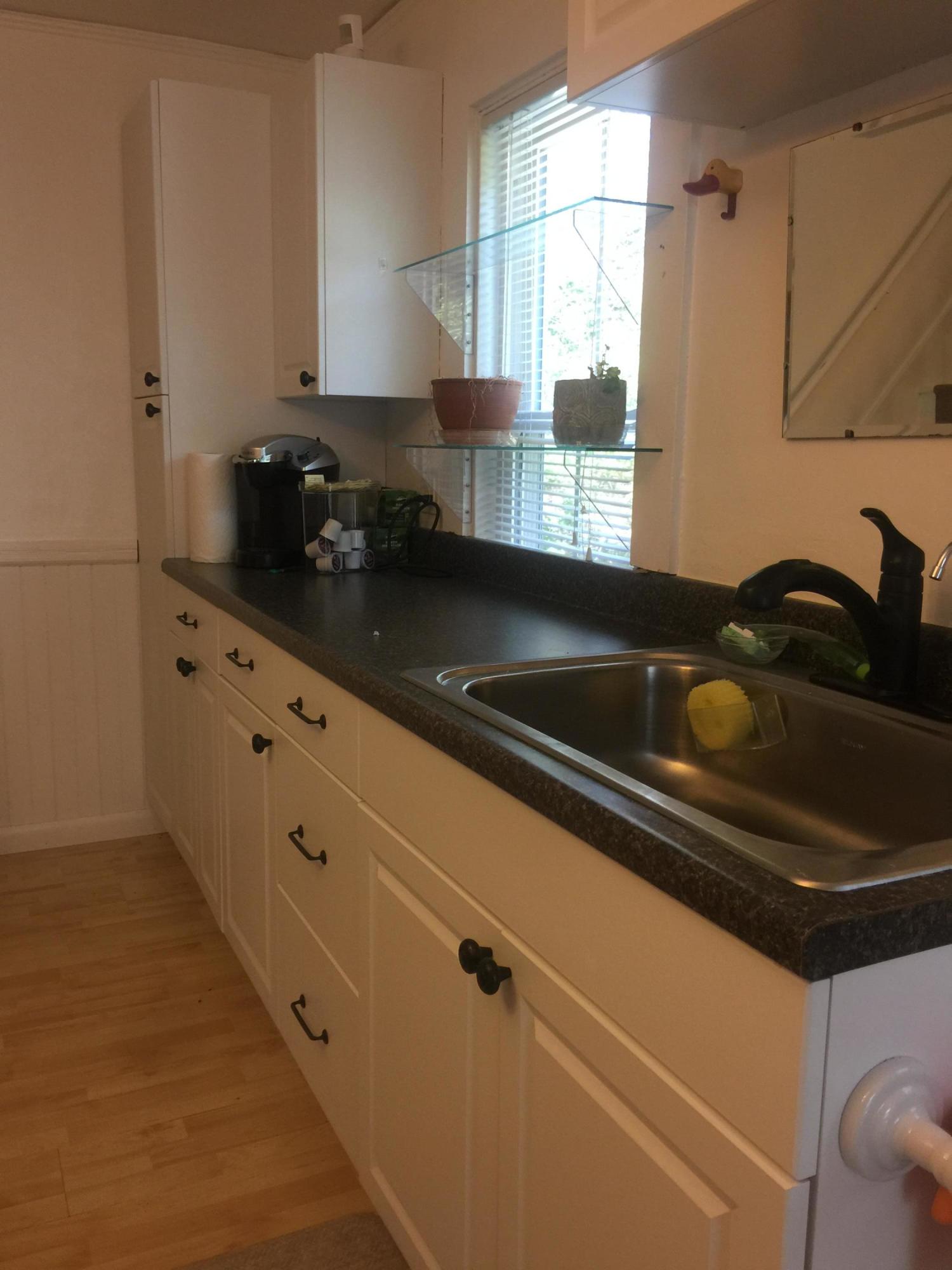 77 Brick Kiln Road Falmouth, MA 02536 - Photo 4 of 10 a kitchen with granite countertop a sink and a stove