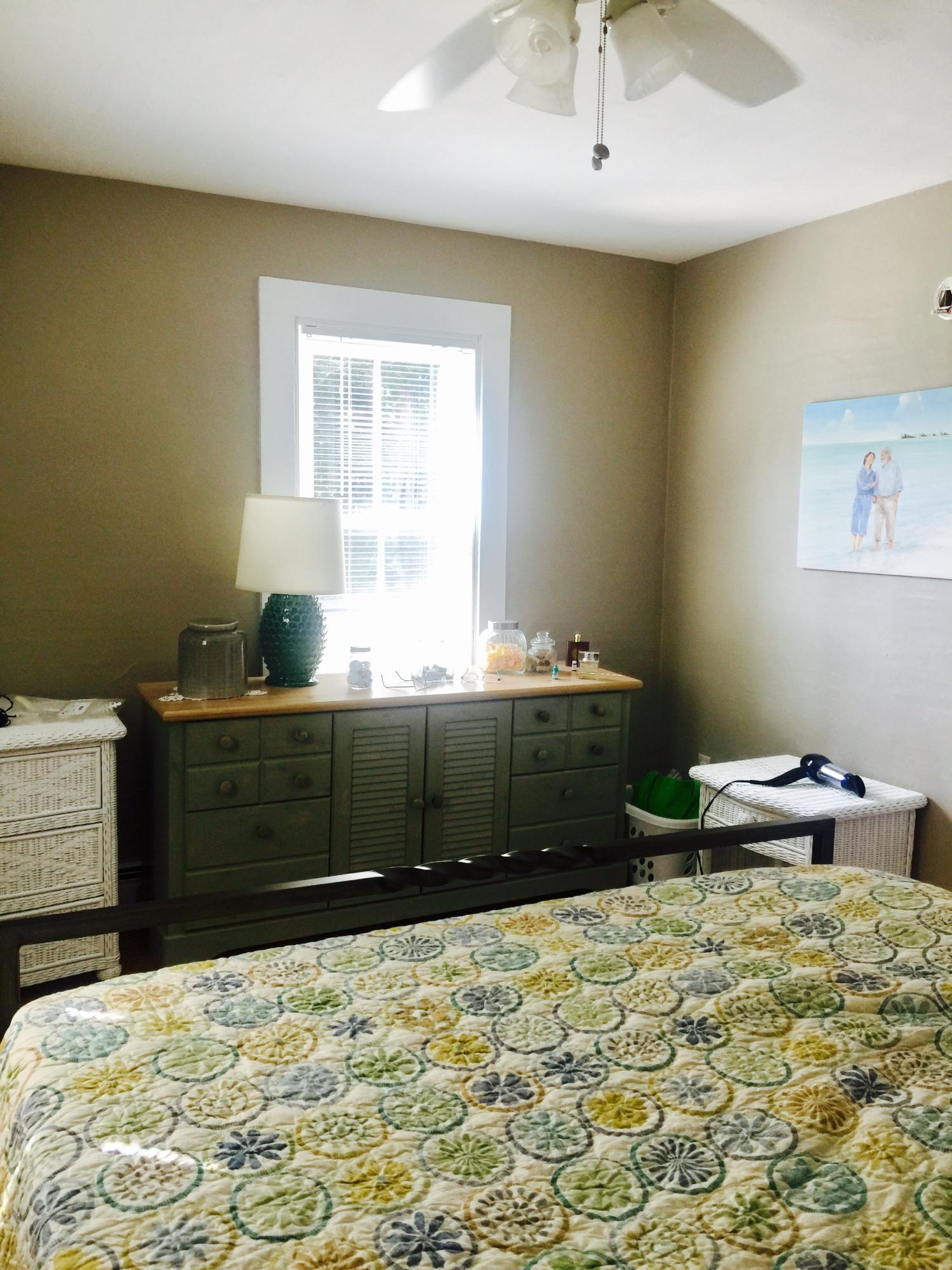 77 Brick Kiln Road Falmouth, MA 02536 - Photo 6 of 10 a bedroom with a bed and a cabinets