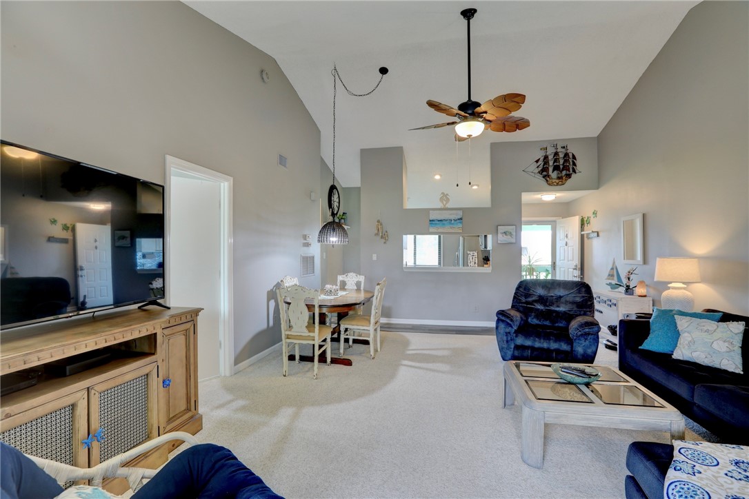 5725 Pelican Pointe Drive, Unit 4 Sebastian, FL 32958 - Photo 11 of 36 a kitchen with stainless steel appliances granite countertop a stove and a couch