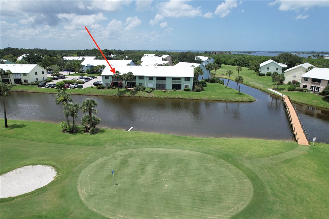5725 Pelican Pointe Drive, Unit 4 Sebastian, FL 32958 - Photo 4 of 36 a view of a lake with a house