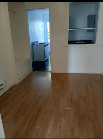 a kitchen with a sink a stove and a window