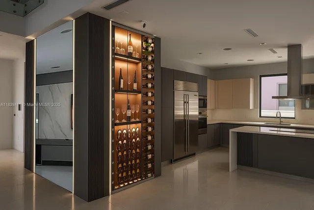 a kitchen with stainless steel appliances granite countertop a refrigerator and a sink