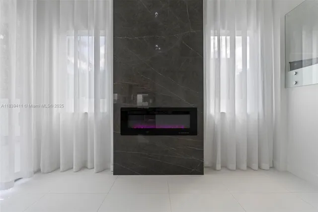 a large kitchen with stainless steel appliances kitchen island granite countertop a sink counter space and cabinets