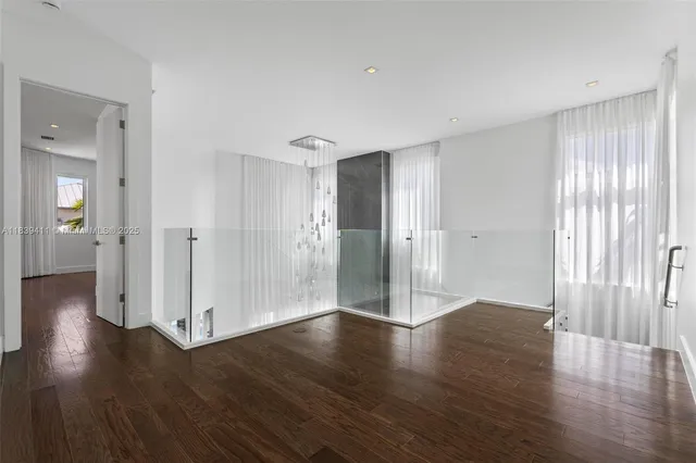 a bathroom with a double vanity sink mirror and shower