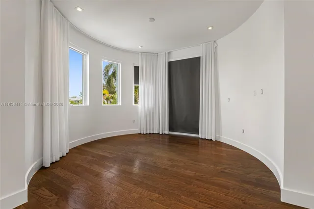 a view of a room with shelf on the wall
