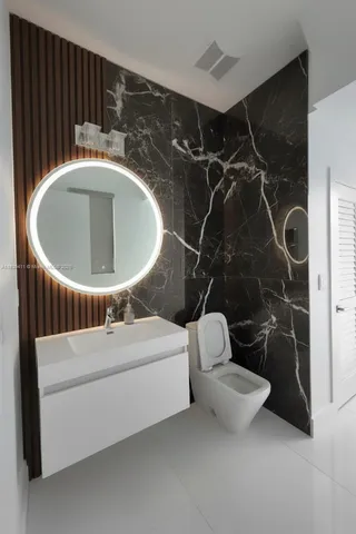 a bathroom with a sink and mirror