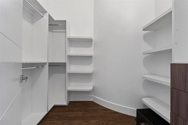 an empty room with wooden floor