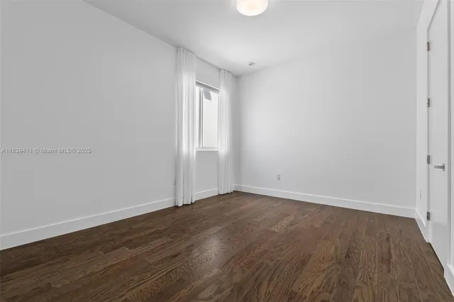 a view of a hallway with washer and dryer