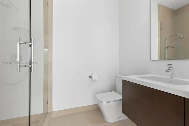 a view of swimming pool with lounge chair and palm trees
