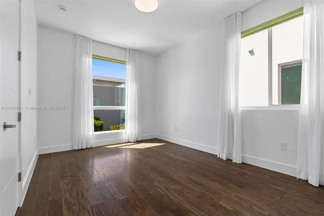 a view of backyard with swimming pool and outdoor seating