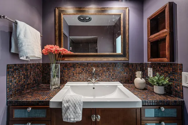 a bathroom with a sink and a mirror