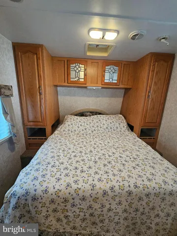 a bathroom with a sink a toilet and shower curtain