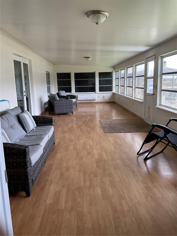2128 Southeast 32nd Street Okeechobee, FL 34974 - Photo 36 of 61 a living room with furniture gym equipment and a large window