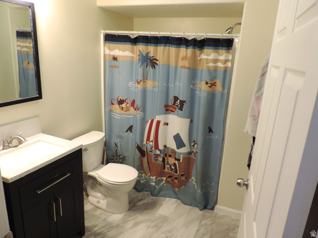 8198 North Cedar Springs Road, Unit 5 Eagle Mountain, UT 84005 - Photo 16 of 30 Bathroom with vanity and curtained shower