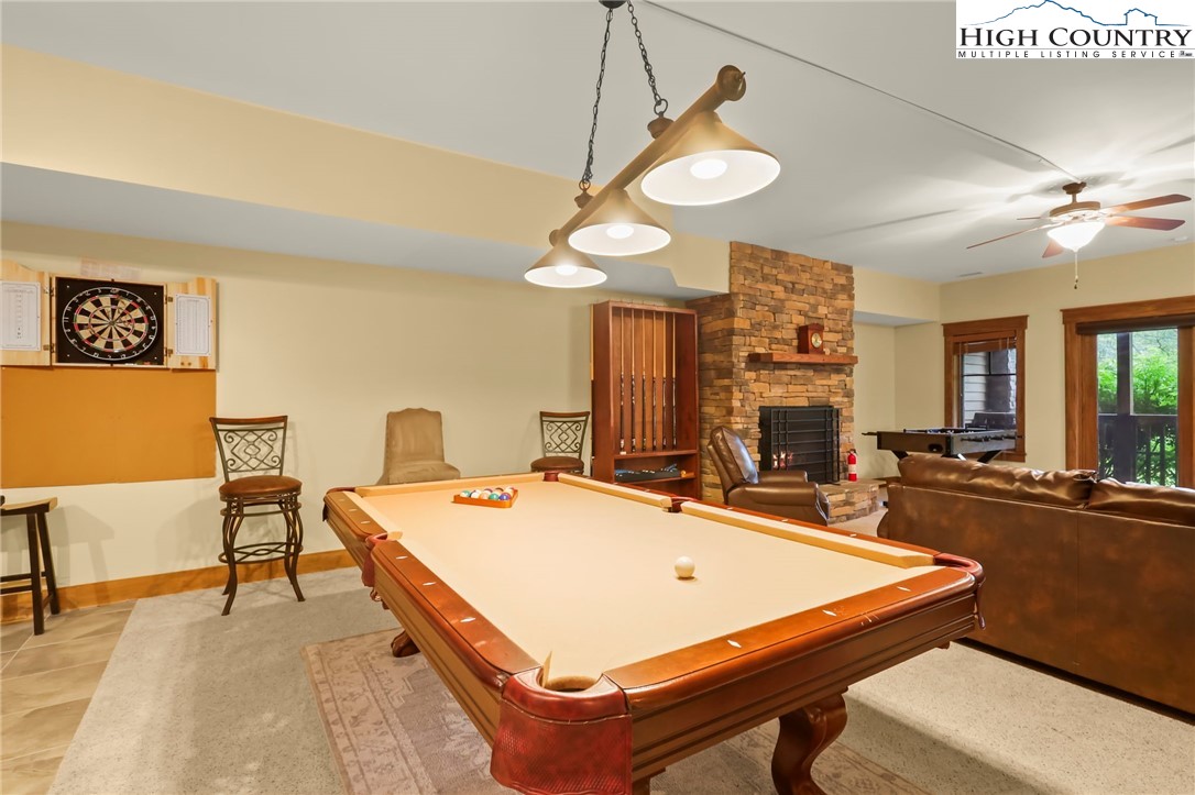 138 South Camp Road, Unit 103 Boone, NC 28607 - Photo 41 of 50 a room with table chairs and a chandelier
