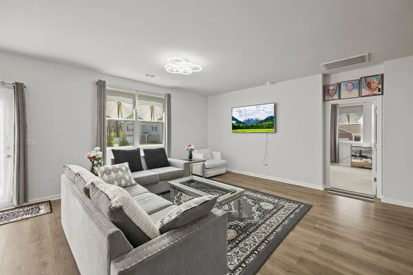 a living room with furniture and a window