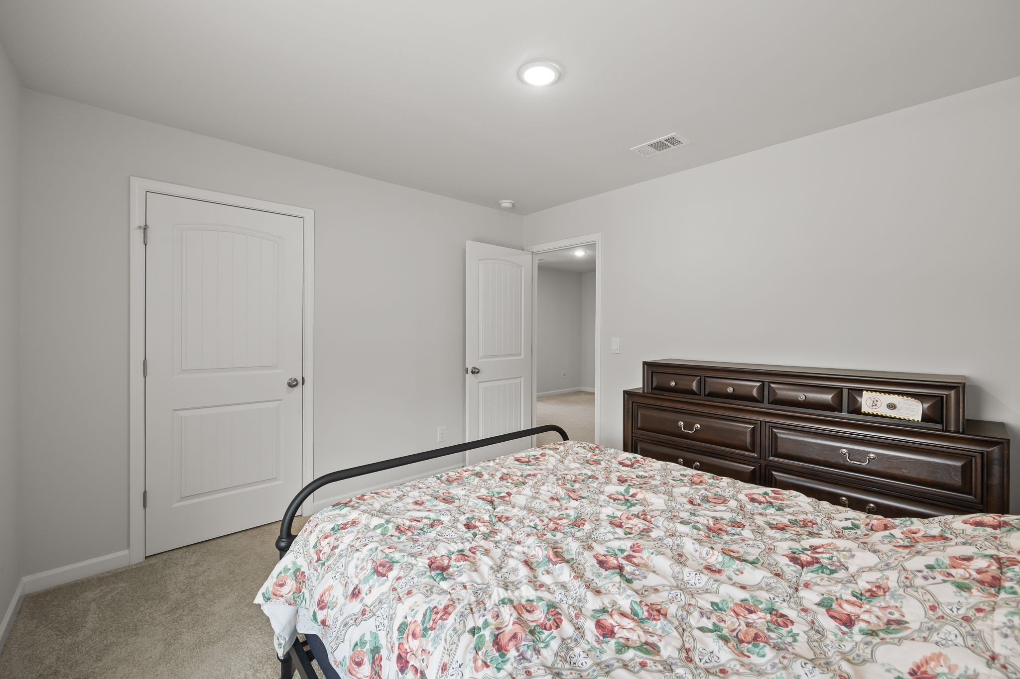 301 Oliver Way Baxter, TN 38544 - Photo 20 of 26 a bedroom with a bed and a dresser