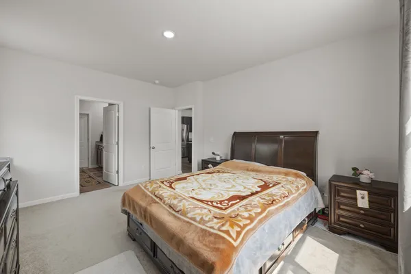 a bedroom with a bed and a closet