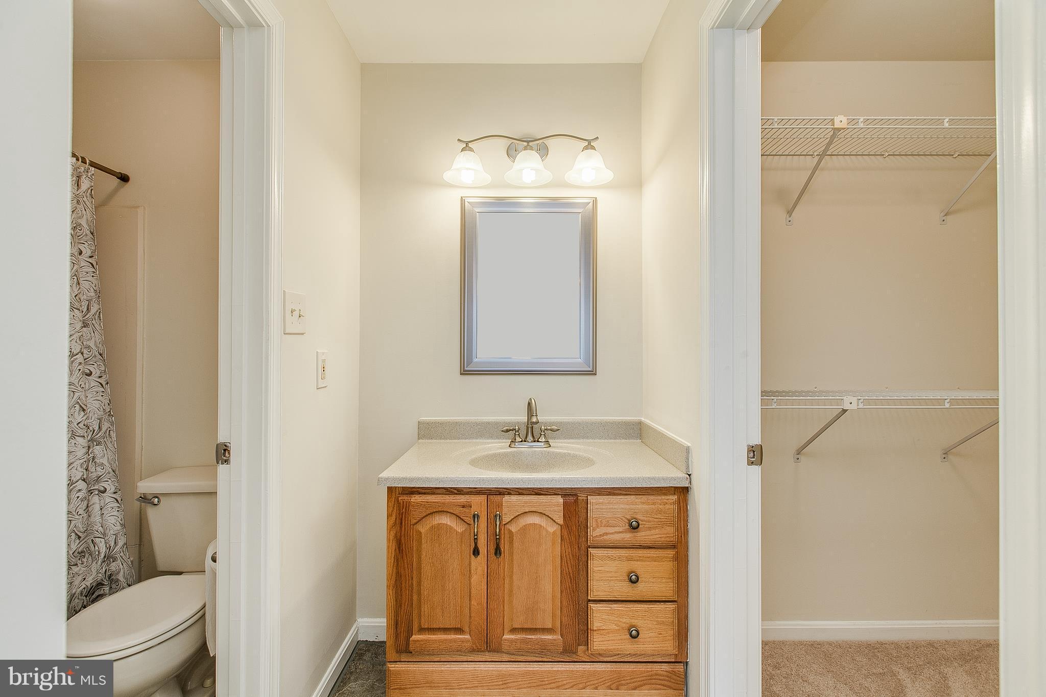 8601 Falls Run Road, Unit F Ellicott City, MD 21043 - Photo 13 of 17 a bathroom with a sink and a mirror