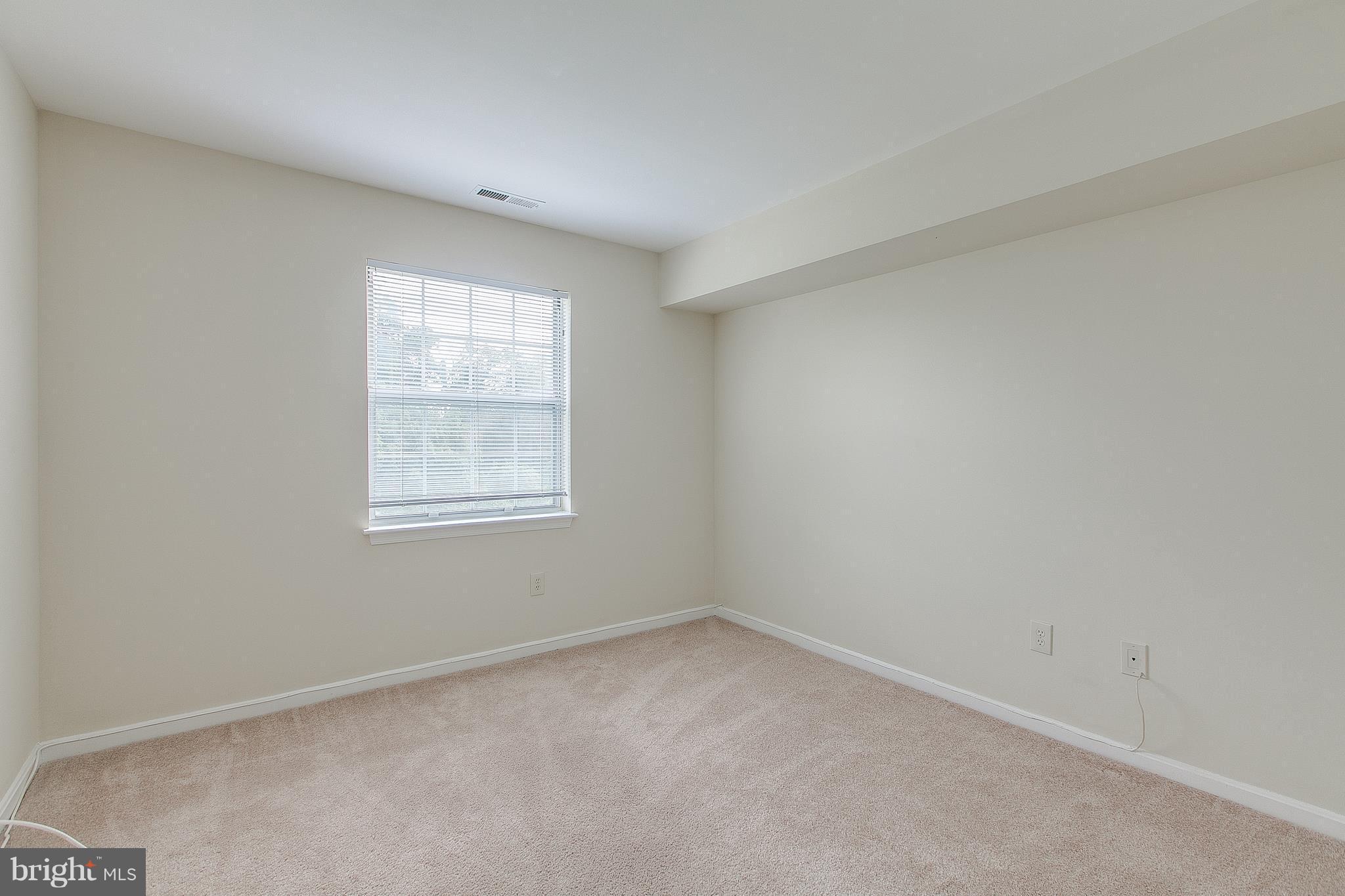 8601 Falls Run Road, Unit F Ellicott City, MD 21043 - Photo 14 of 17 an empty room with a window