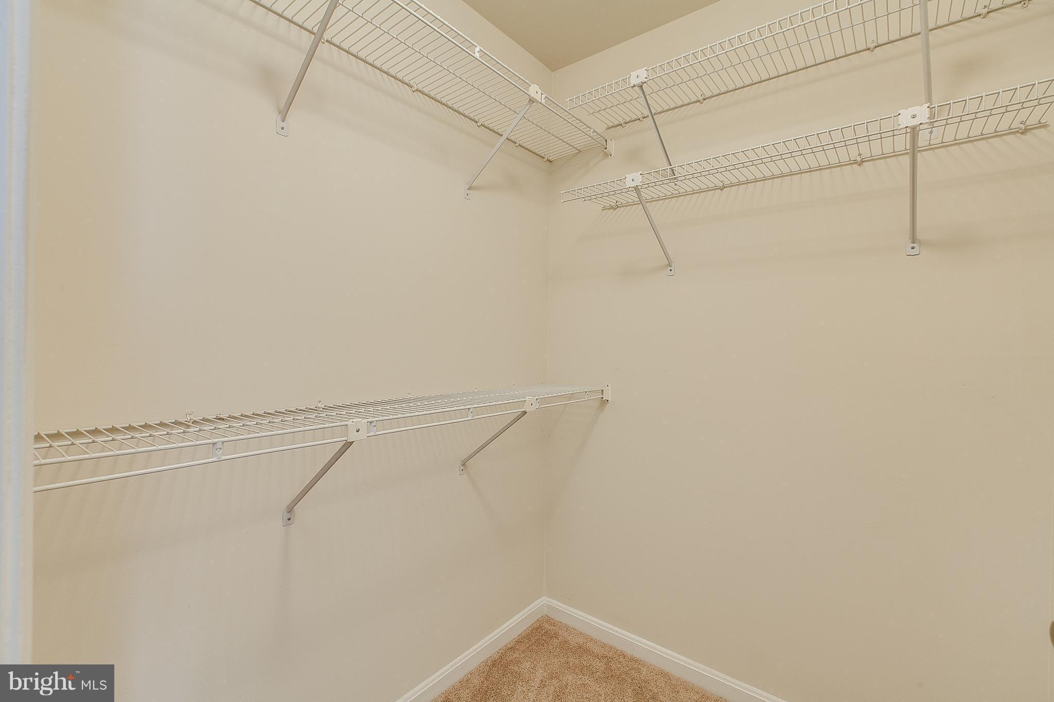 8601 Falls Run Road, Unit F Ellicott City, MD 21043 - Photo 15 of 17 a view of a room with racks on the wall