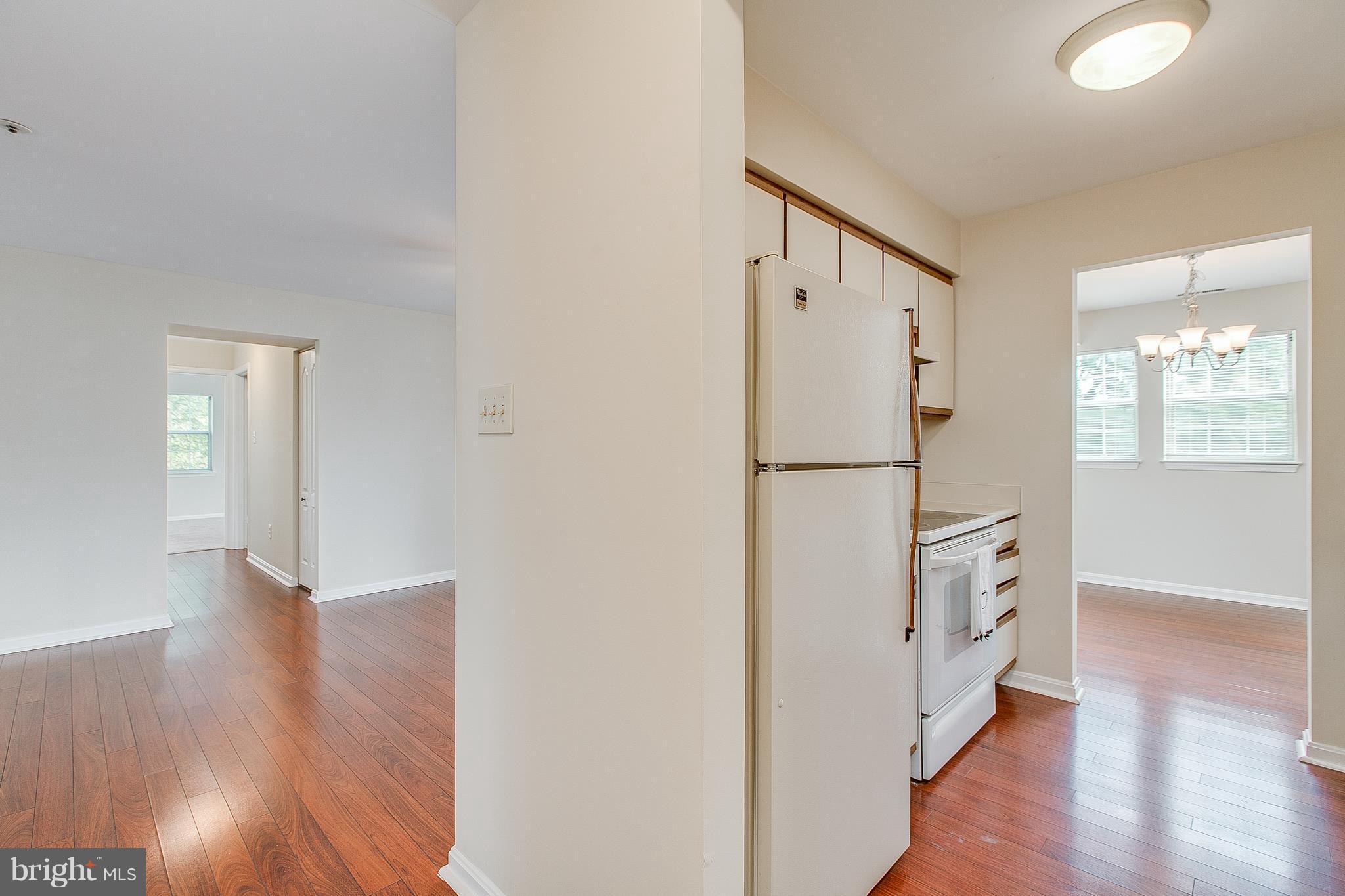 8601 Falls Run Road, Unit F Ellicott City, MD 21043 - Photo 5 of 17 a view of livingroom with hardwood and hallway