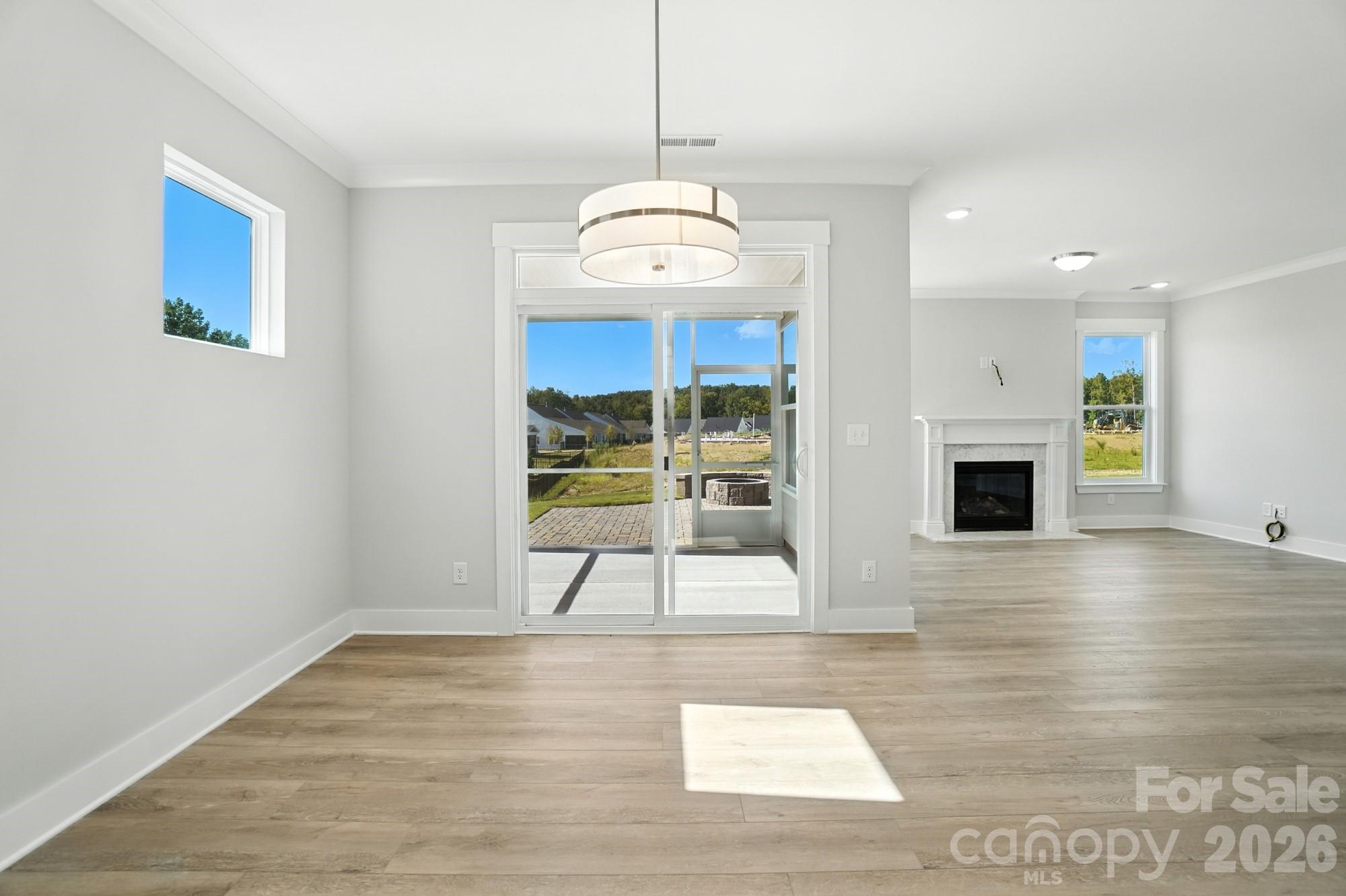 2007 Mantle Rdg Drive Indian Trail, NC 28079 - Photo 11 of 48 a view of an empty room with a fireplace and a window