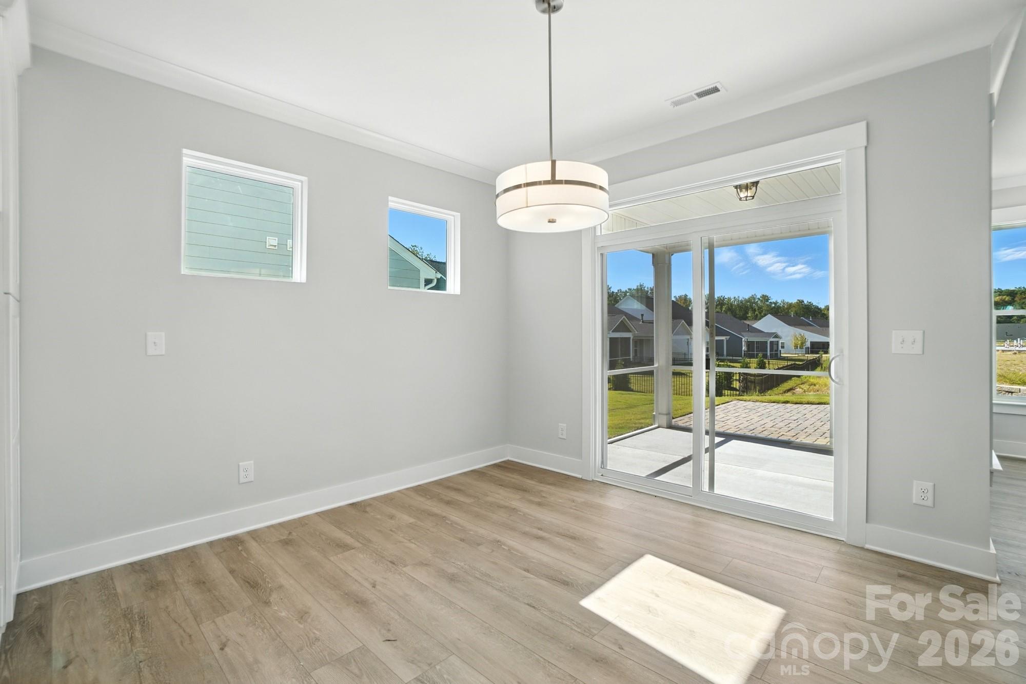 2007 Mantle Rdg Drive Indian Trail, NC 28079 - Photo 12 of 48 a view of an room with wooden floor and ceiling fan