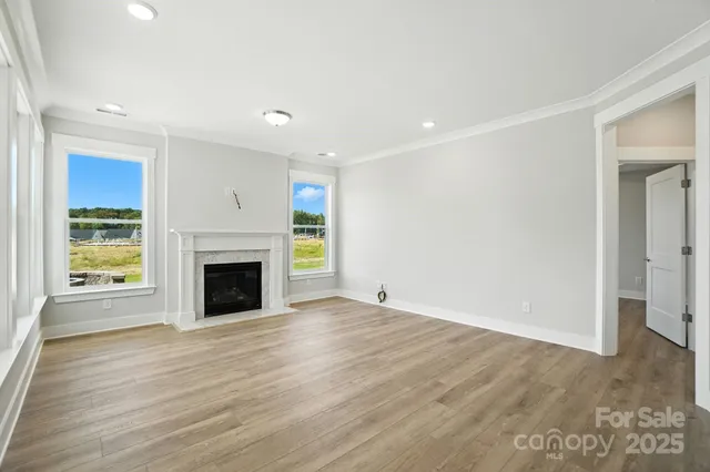a living room with a fireplace and a window