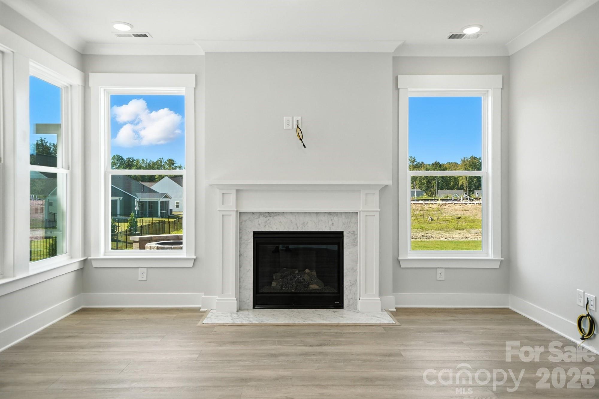 2007 Mantle Rdg Drive Indian Trail, NC 28079 - Photo 14 of 48 a living room with a fireplace and a window