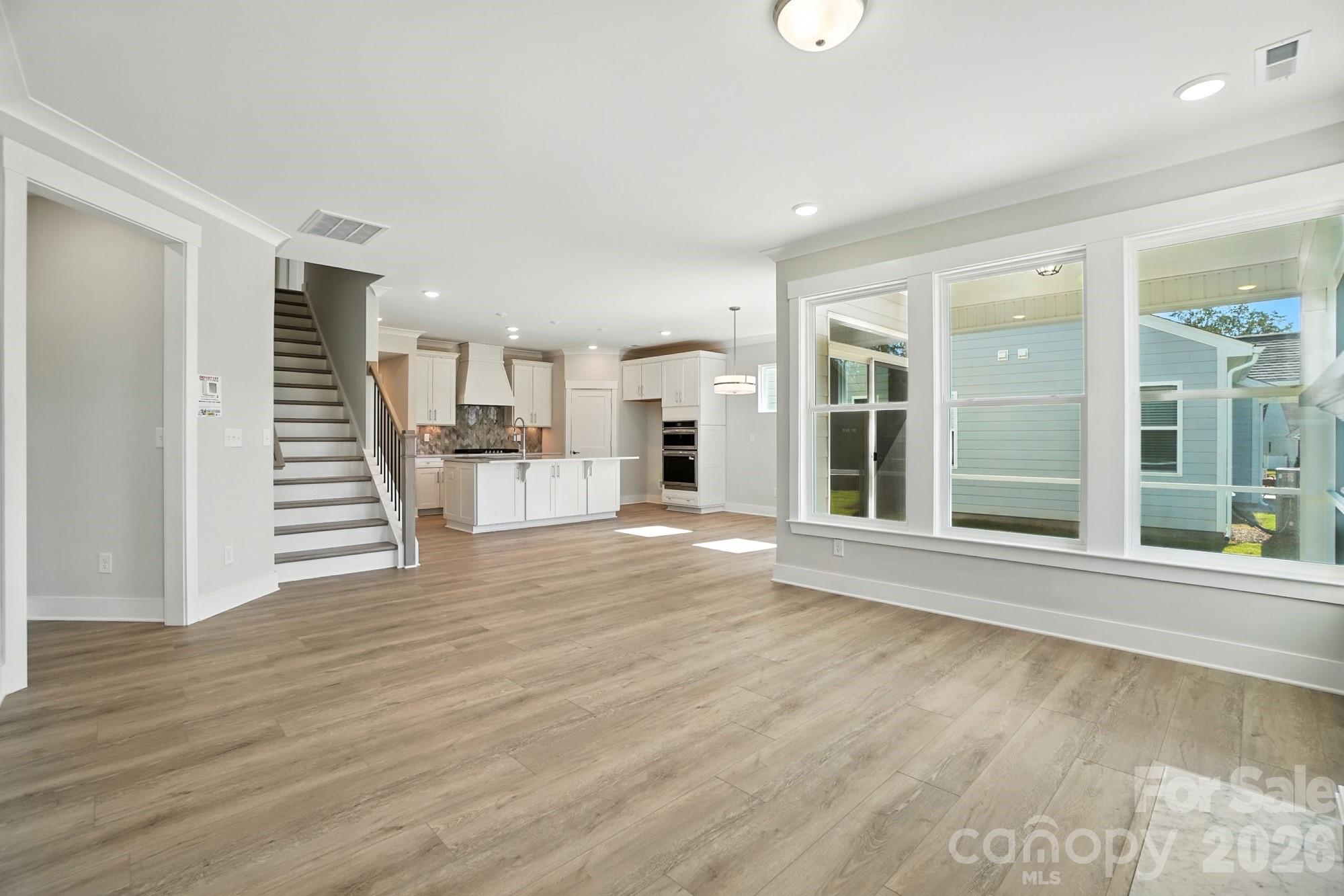 2007 Mantle Rdg Drive Indian Trail, NC 28079 - Photo 15 of 48 a view of a living room with wooden floor and a fireplace