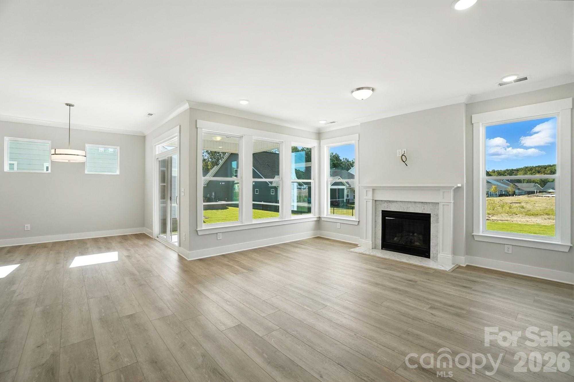 2007 Mantle Rdg Drive Indian Trail, NC 28079 - Photo 16 of 48 a view of an empty room with wooden floor and a window