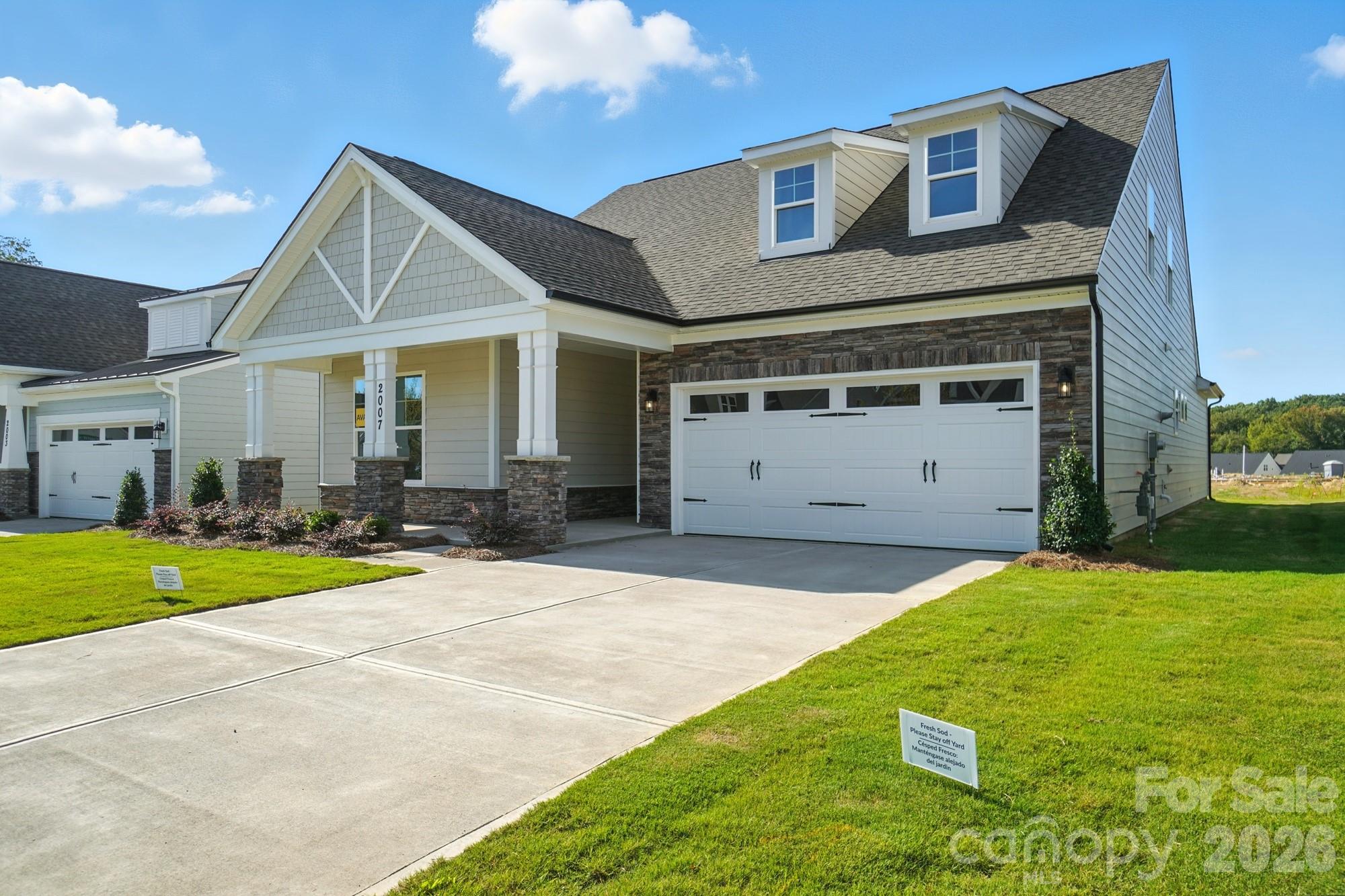 2007 Mantle Rdg Drive Indian Trail, NC 28079 - Photo 2 of 48 a front view of a house with a yard and garage