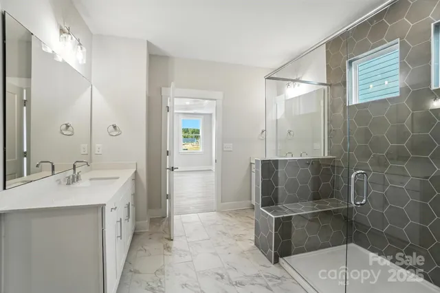a bathroom with a shower and a tub