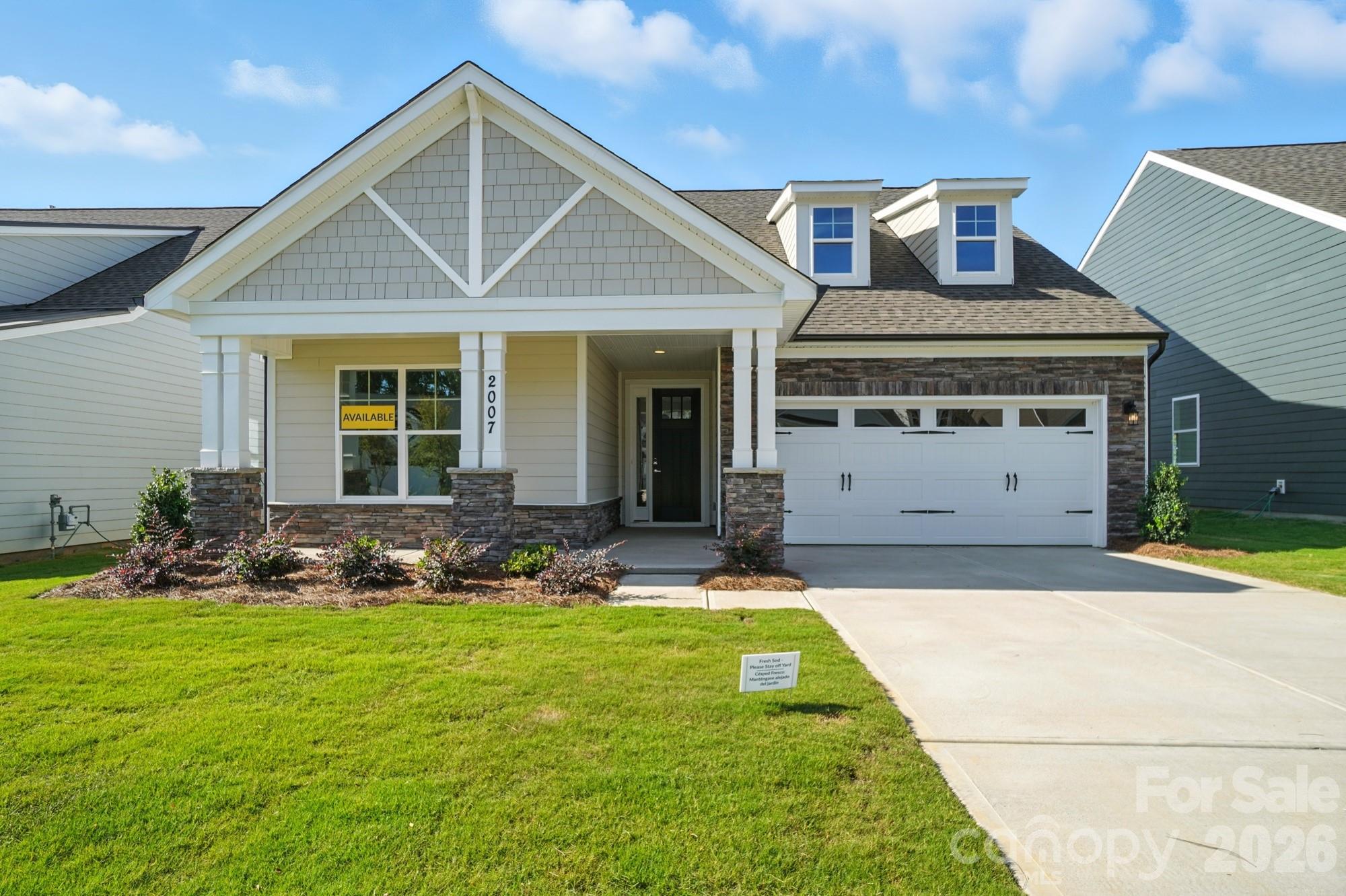 2007 Mantle Rdg Drive Indian Trail, NC 28079 - Photo 3 of 48 a front view of a house with garden