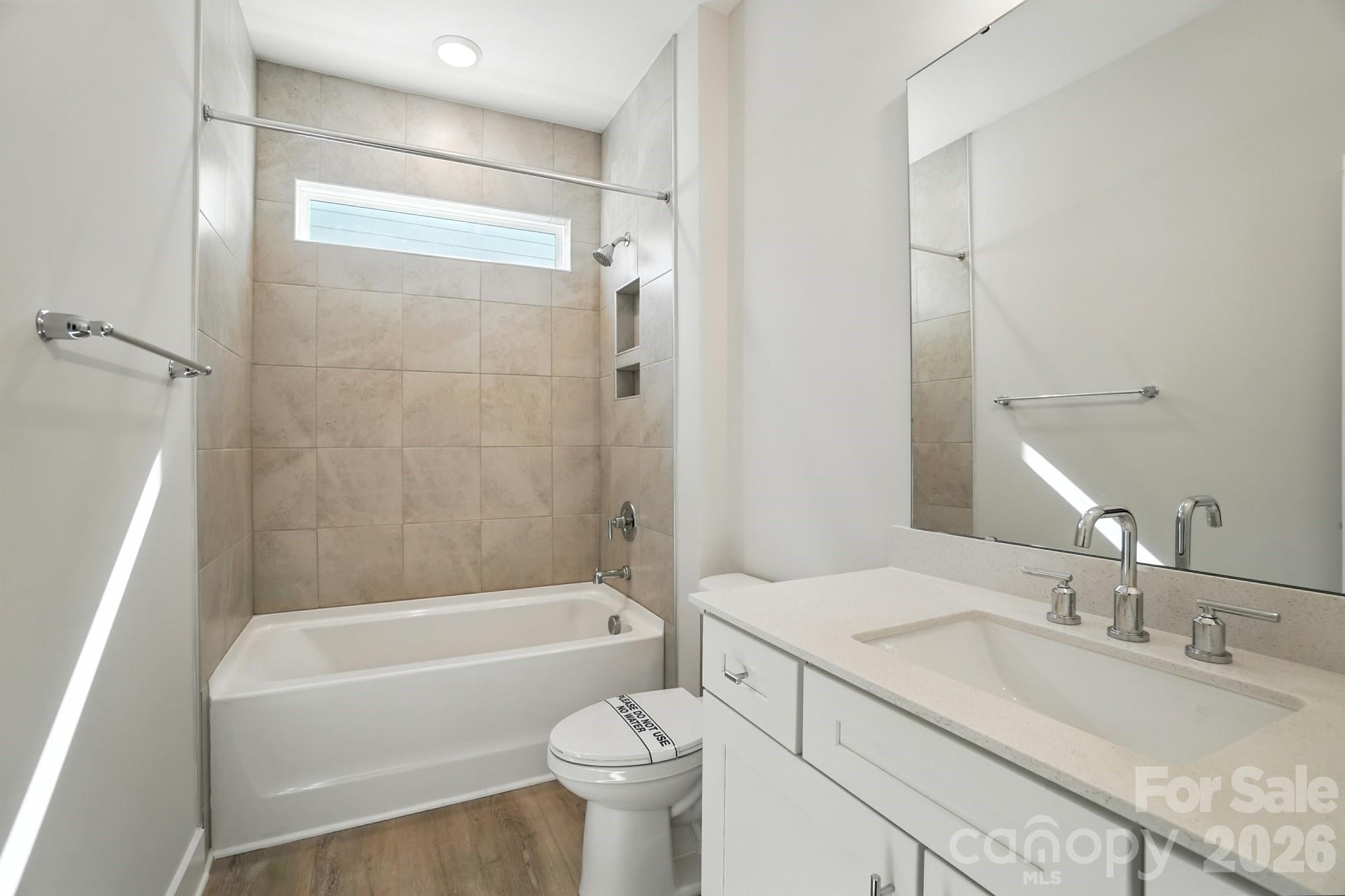 2007 Mantle Rdg Drive Indian Trail, NC 28079 - Photo 31 of 48 a bathroom with a granite countertop bathtub shower sink vanity mirror and toilet