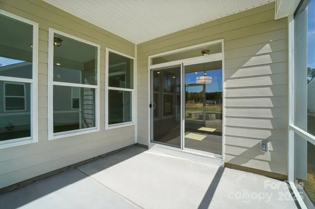 a view of a swimming pool with a porch