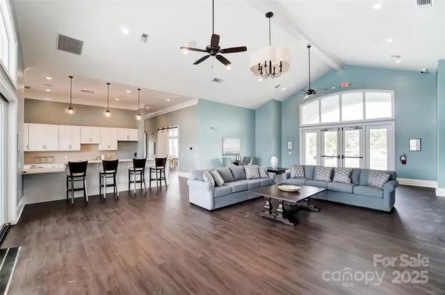 a view of a patio with a dining table chairs and garden view