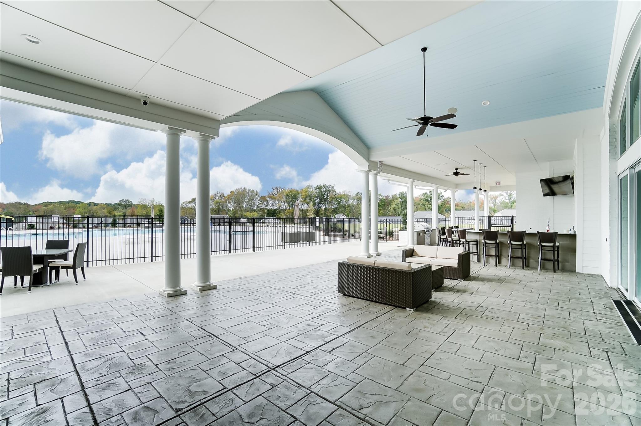 2007 Mantle Rdg Drive Indian Trail, NC 28079 - Photo 46 of 48 a view of a patio with a dining table chairs and garden view
